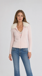 Front view of model wearing pink faux fur collar zip cardigan with jeans