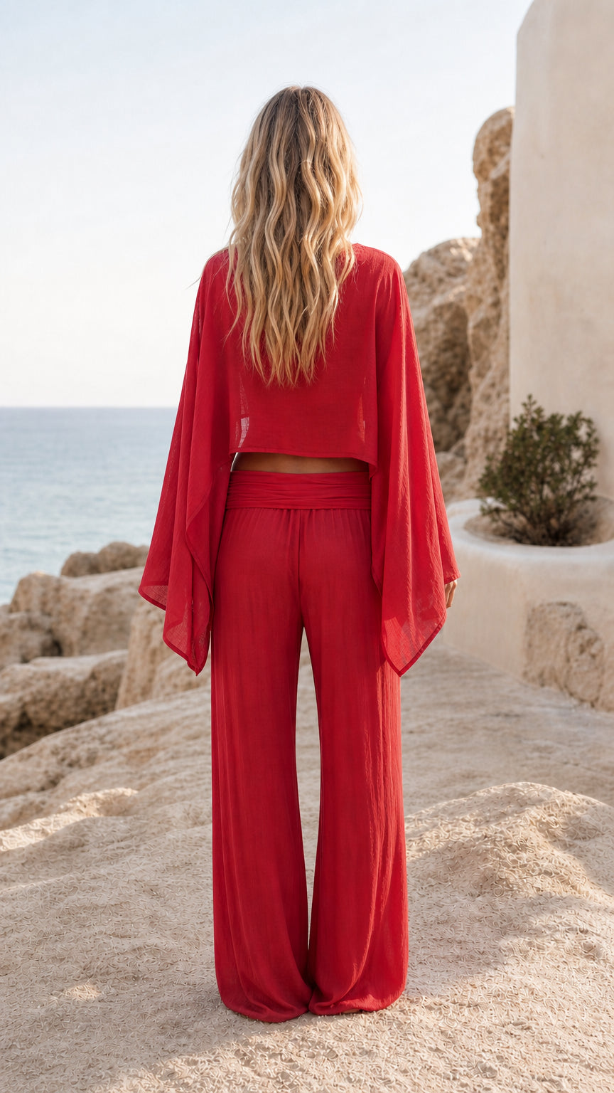 Back view of women's red matching lounge set with flowy sleeves