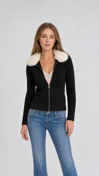 Front view of model wearing black faux fur collar zip cardigan with jeans