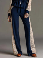 Elegant Navy Vertical Ribbed Knit Two Piece Outfit Zip Front Peplum Top Off White Floral Lace Panel Wide Leg Pants